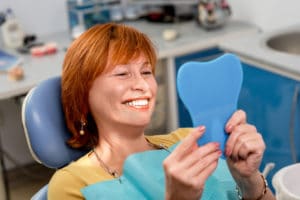 women smiling after dental implant procedure